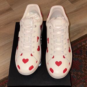 New authentic Coach Valentines work, size 10B.